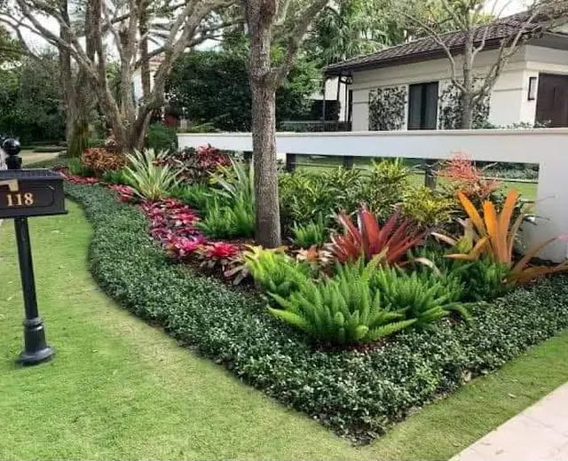 Layered garden planting beside a home